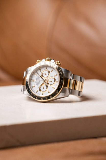 Rolex Daytona 16523 white dial angled view on two-tone Oyster bracelet