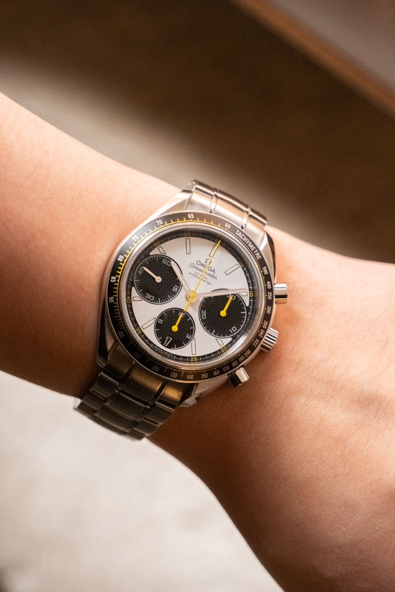 2024 OMEGA Speedmaster Racing White Dial with Yellow Accents Ref. 326.30.40.50.04.001 - Wristory