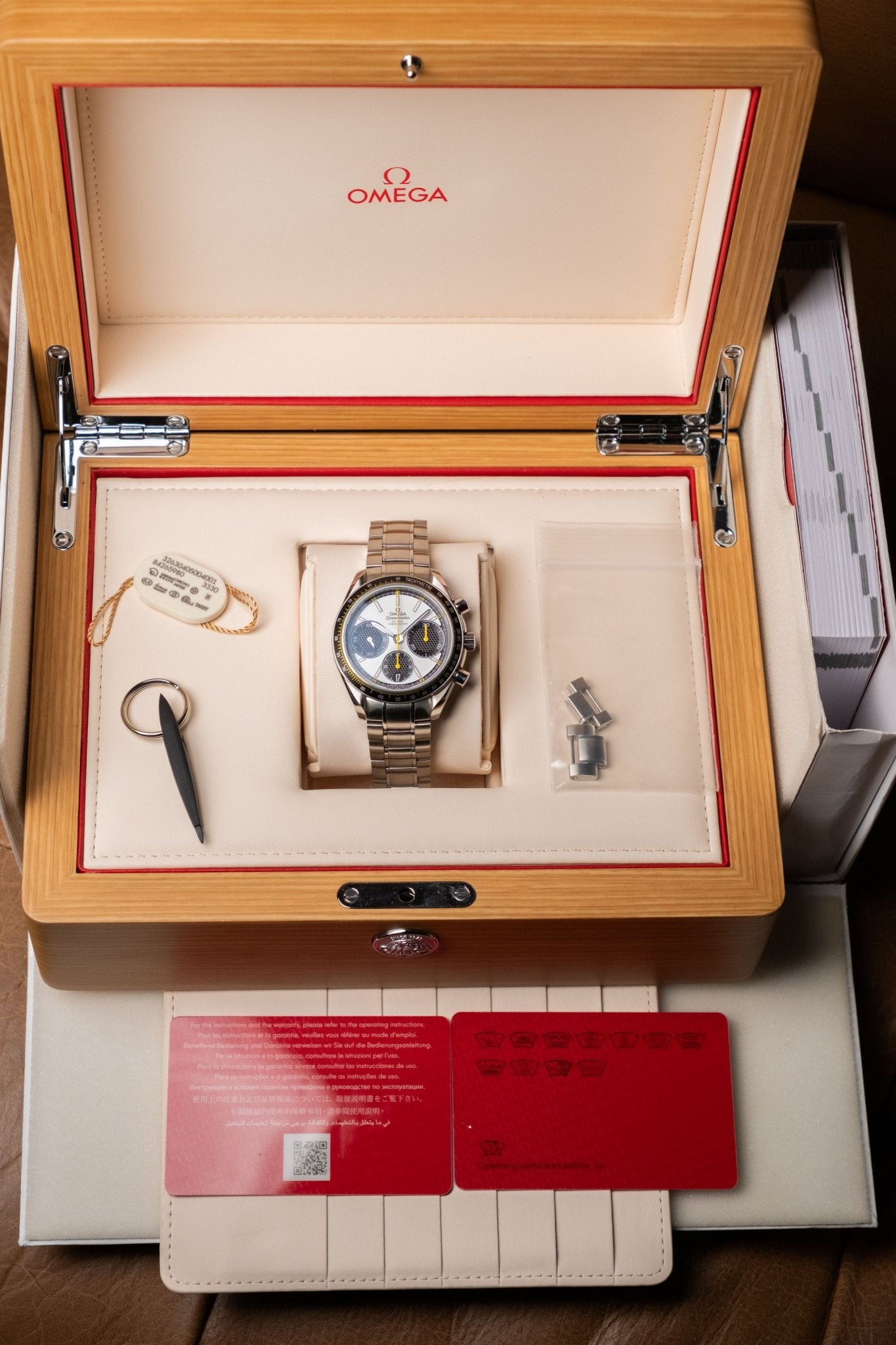 2024 OMEGA Speedmaster Racing White Dial with Yellow Accents Ref. 326.30.40.50.04.001 - Wristory