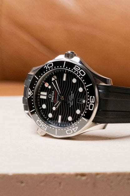 2025 OMEGA Seamaster Diver 300M Black Wave Dial on Rubber Ref 210.32.42.20.01.001 - Wristory
