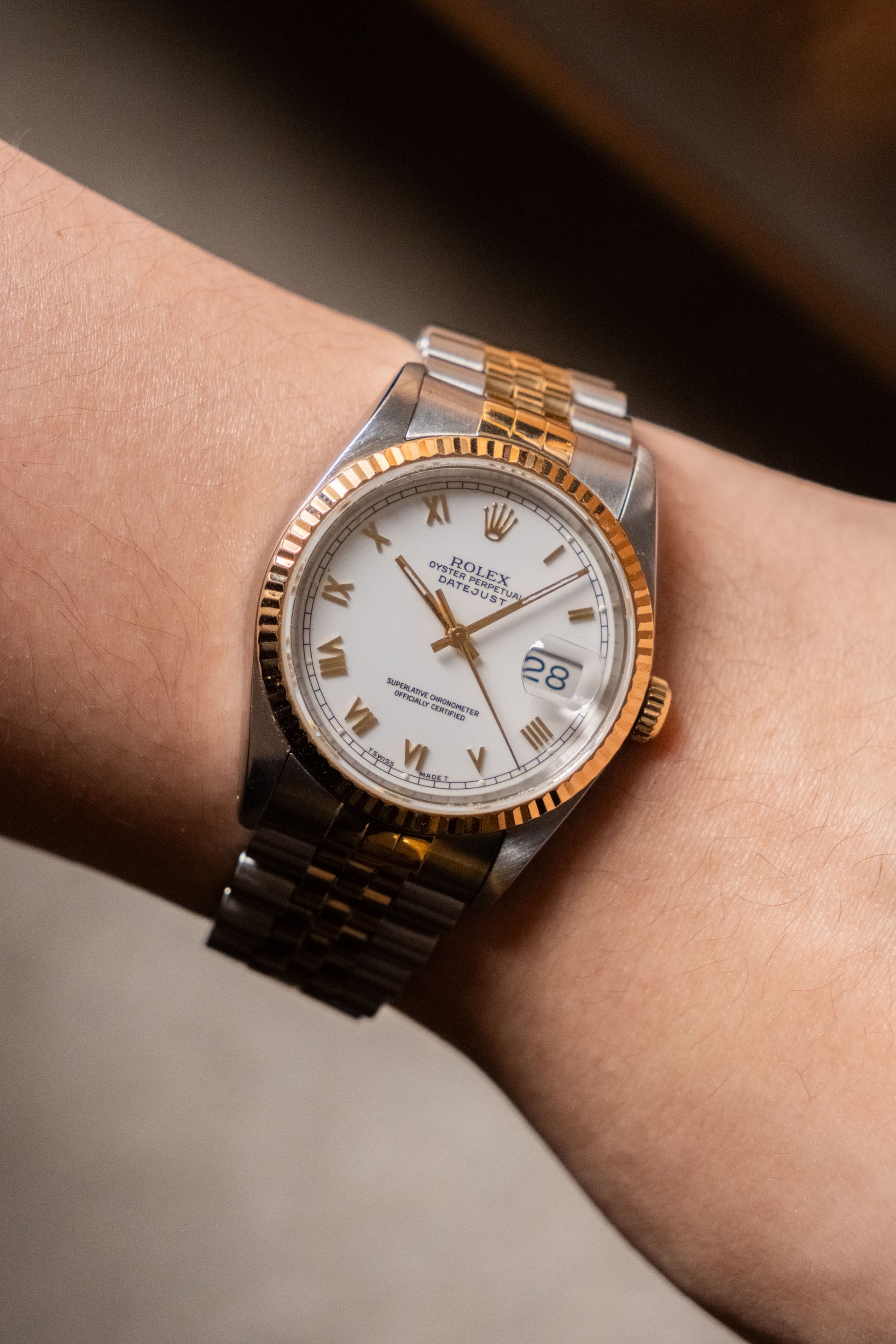1993 Rolex Datejust 36 Two-Tone White Roman Dial Ref 16233 angled view - Wristory